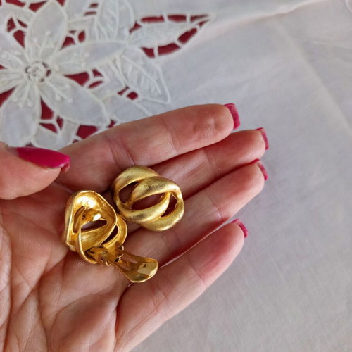 Clip-on earrings used, relief design, bronze tone