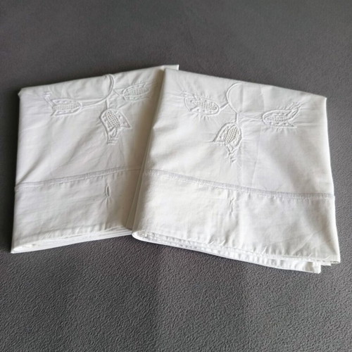 Vintage white cotton pillowcases pair with embroidery used