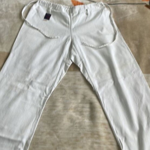 Martial arts pants used with white and yellow belt for adults