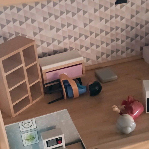 Wooden dollhouse used with extra accessories pack