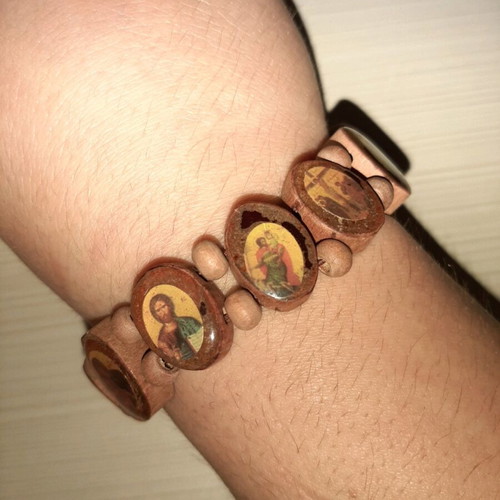 Bracelet with saint images like new with elastic cord