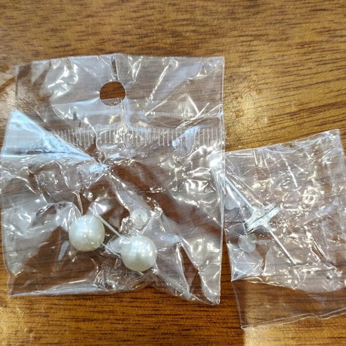Two pairs of earrings new, pearl and infinity with silicone clasp