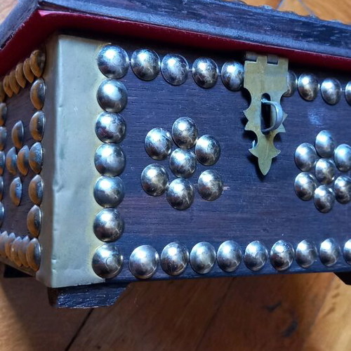Decorative small wooden chest used with metal details