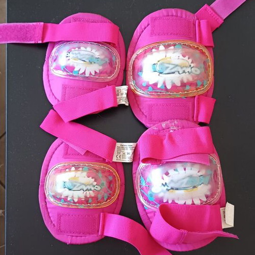 Roller skates used, size 33-36 with helmet and protective gear