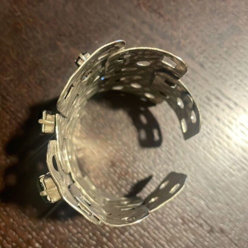 Silver cuff bracelet like new with hammered texture and green stones