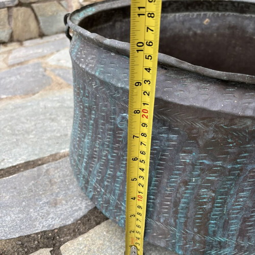 Vintage copper cauldron with hand-forged decoration used