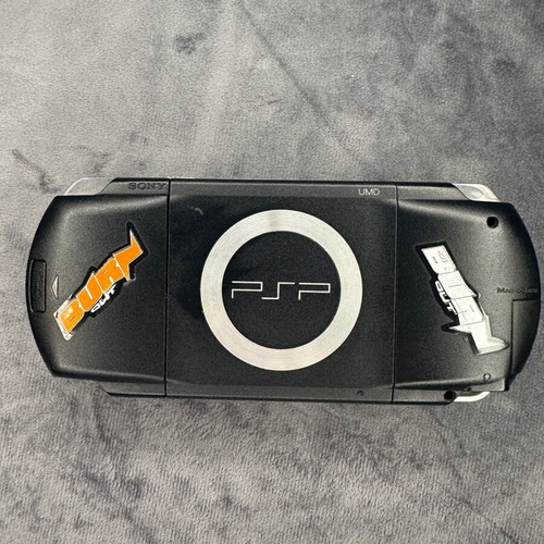 PlayStation Portable PSP-1000 used with charger, 5 games, and Memory Stick