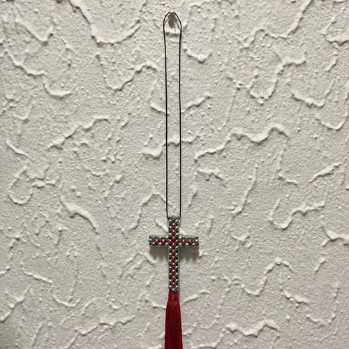 Decorative cross with beads and red tassel like new
