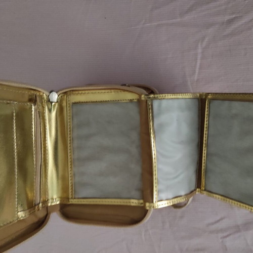 Small gold wristlet shoulder bag