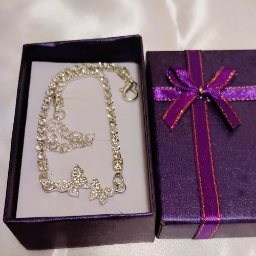 Bracelet with shiny butterflies new, white and silver