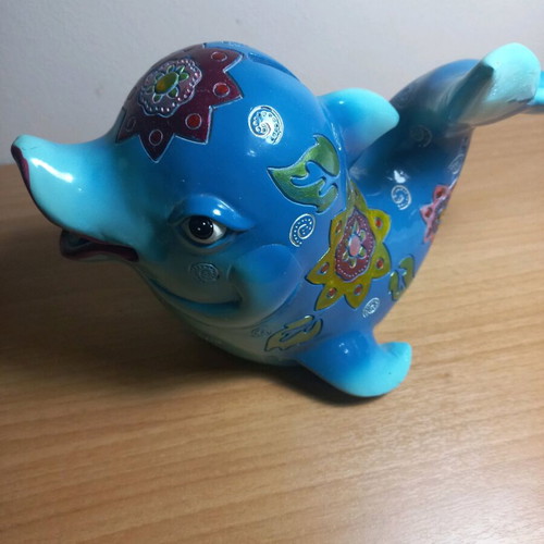 Dolphin piggy bank with designs like new