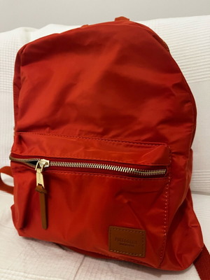 Backpack warm orange like new with matte zipper and leather details