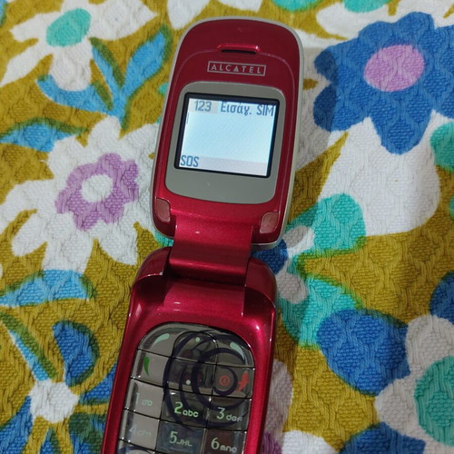 Alcatel vintage flip phone used, red, charger included
