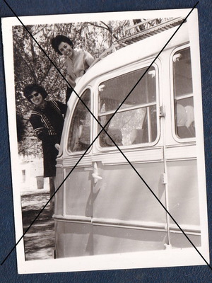 Portrait of young women on back of tour bus used photo