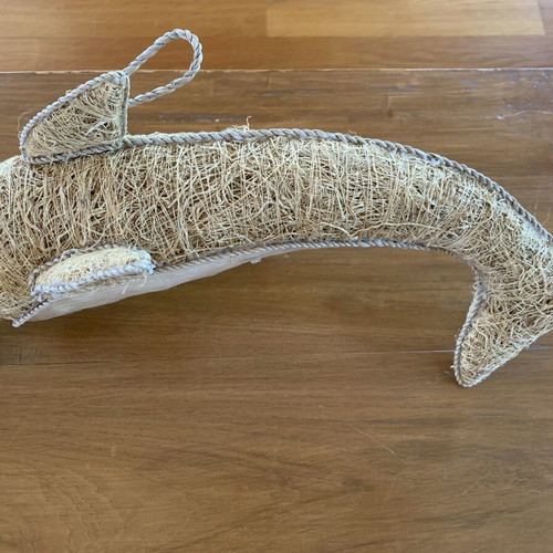 Handmade decorative dolphin made of grass