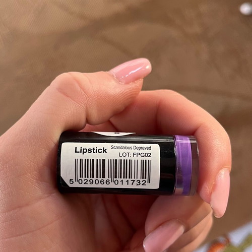 Makeup Revolution Scandalous Lipstick used once, purple shade, moisturizing