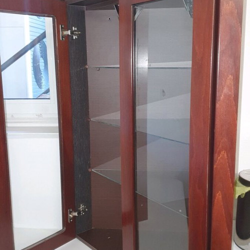 Corner showcase furniture like new with 3 shelves, 2 doors and spotlights