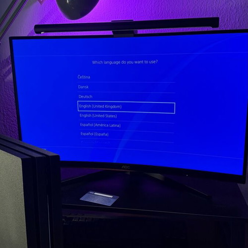 PlayStation 4 Pro used with controller and two games