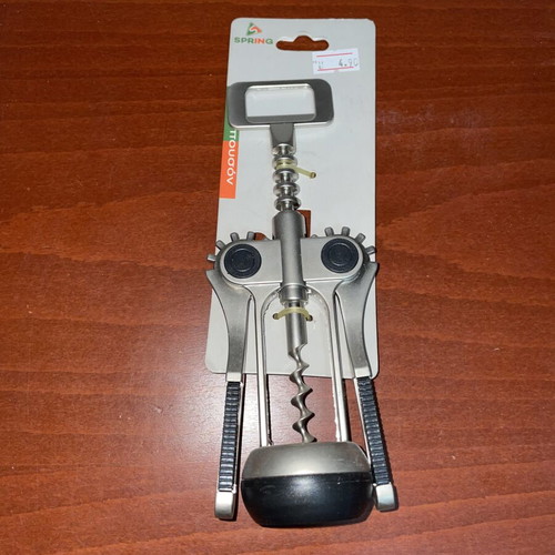 Spring metal corkscrew with non-slip handles