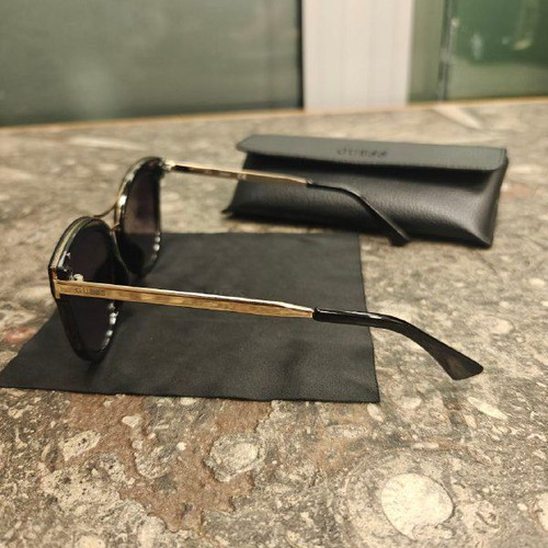 Guess women's sunglasses with black protective case and cloth