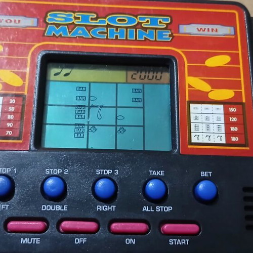 Vintage handheld electronic game slot machine like new