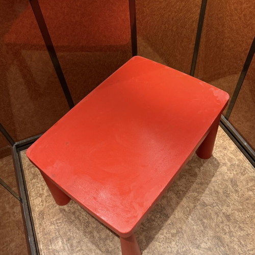 Children's red plastic table used, ideal for play and crafts