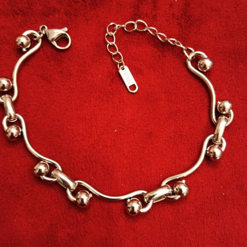 Stainless steel bracelet new, silver with intricate fastening