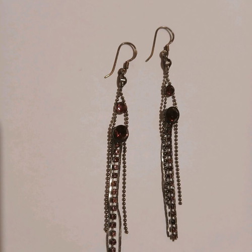 Dangling earrings with purple stones used