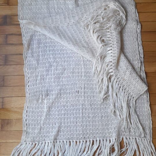 Knitted white scarf used with slight yellowing