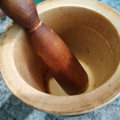 Wooden garlic grater used