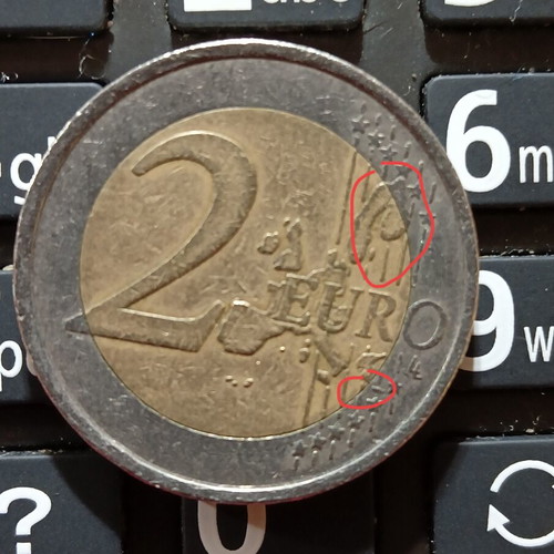 Spanish 2€ coin used 1999 with collectible error