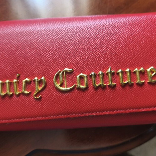Juicy Couture red wallet used with side wear on gold details