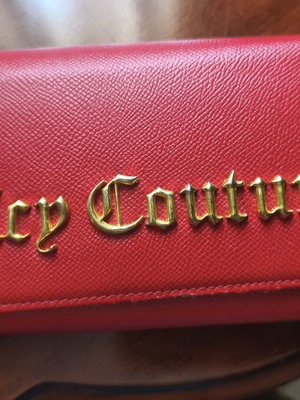 Juicy Couture red wallet used with side wear on gold details
