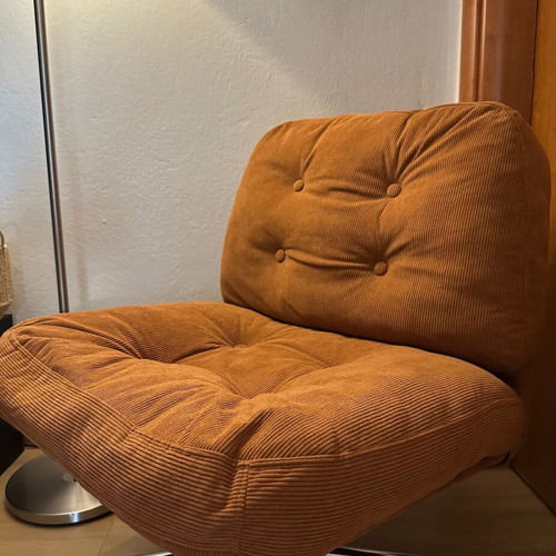 Modern swivel armchair, terracotta fabric and metal