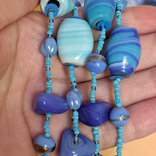 Long necklace like new with blue and purple glass and ceramic stones