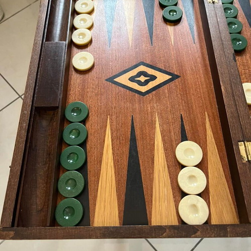 Handmade wooden backgammon used with dice and checkers
