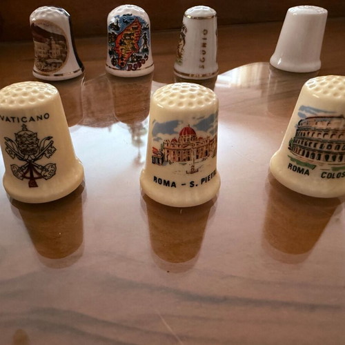 Collection of 12 collectible tourist thimbles