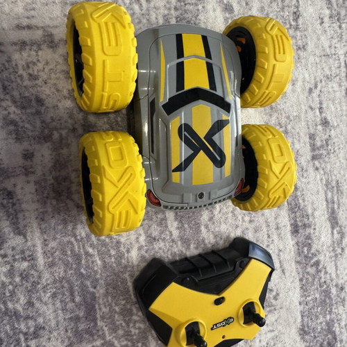 Exost 360 Cross remote control car used with yellow off-road wheels