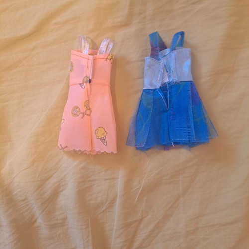 Doll dresses, one peach with ice cream pattern and one blue floral