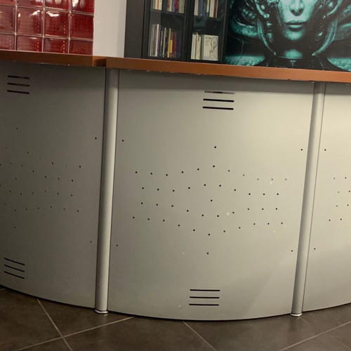 Reception desk used with metal perforated front panel