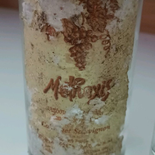 Methexis Distillate Cabernet Sauvignon pack with worn labels