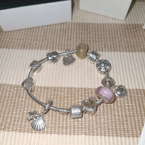 Pandora silver bracelet with 11 charms and collectible clasp, like new