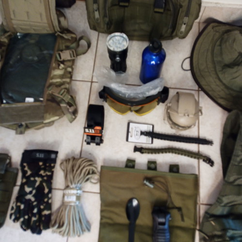 Tactical pack used, assorted gear items