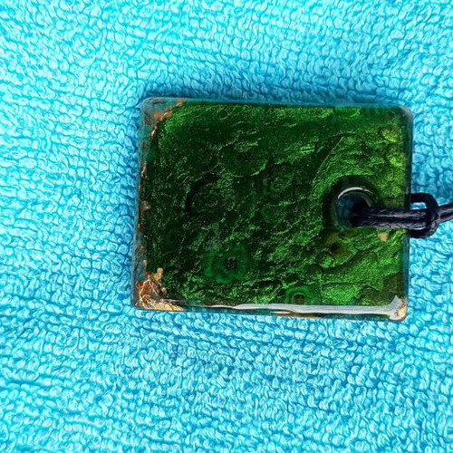 Murano pendant with millefiori floral design and aventurine base
