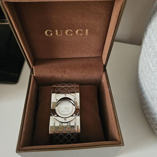 Gucci women's silver round bracelet-style watch like new