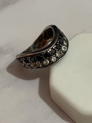 Silver ring with white and black stones used