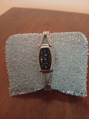 Quartz women's wristwatch like new with steel bracelet and Swarovski stones