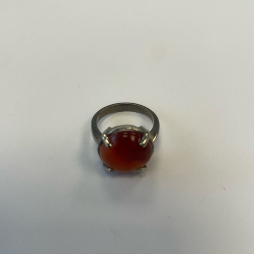 Monopetro ring with brown-red stone used