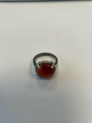 Monopetro ring with brown-red stone used