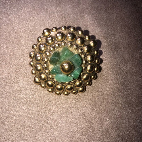 Vintage brooch like new with gold elements and green semi-precious stones